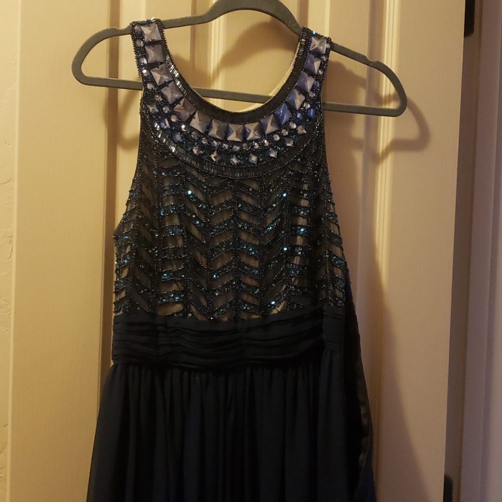 Long formal blue gown with jewels